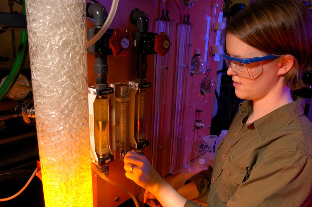 student working with lab equipment