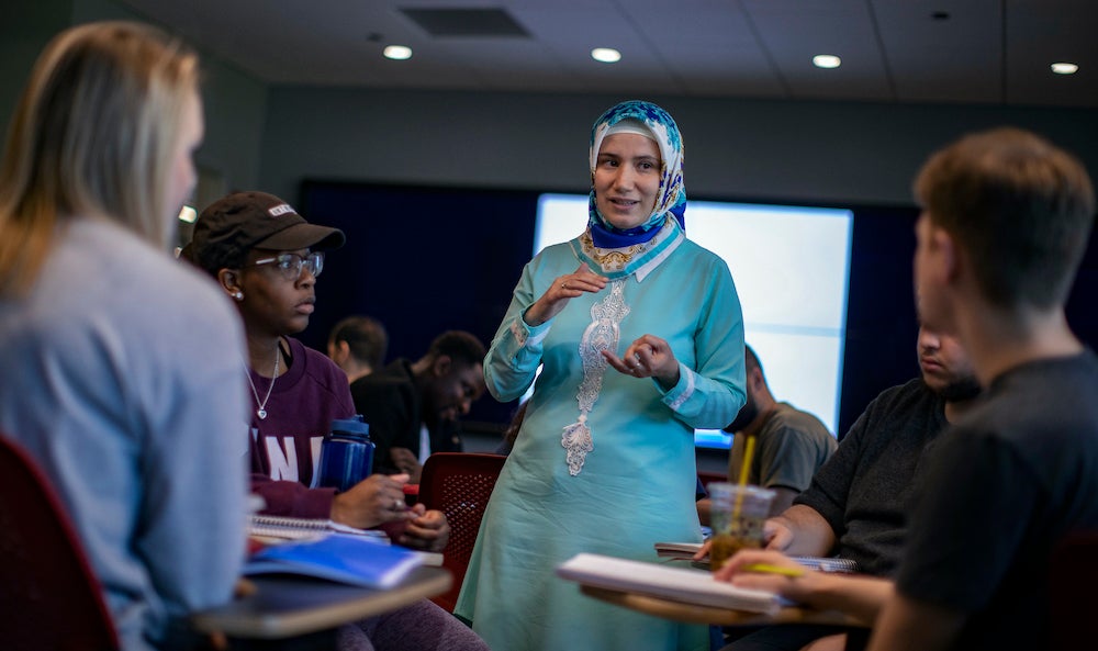 Betul Bilgin teaching students in the engineering innovation building