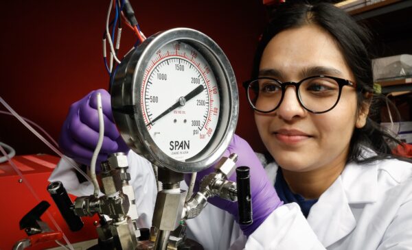 University of Illinois Chicago College of Engineering PhD student Ishita Goyal demonstrates ammonia synthesis in a high pressure reactor in Meenesh Singh's lab,