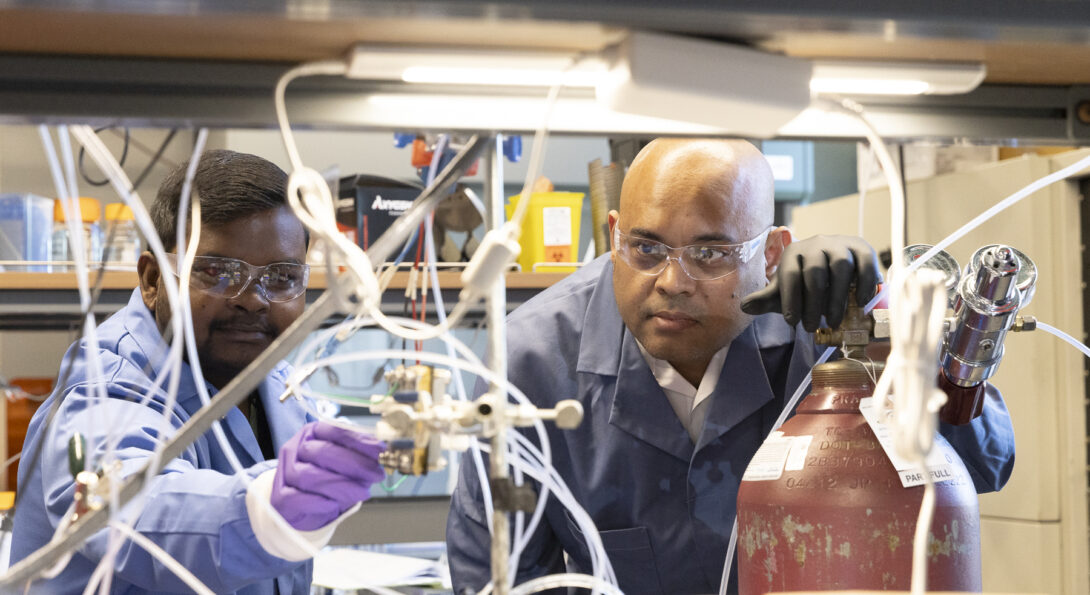 Associate Professor Meenesh Singh, right, and postdoctoral researcher Rohit Chauhan work in Singh’s laboratory at the University of Illinois Chicago.