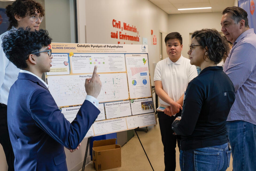 University of Illinois Chicago College of Engineering CHE senior Anoo Venkataramanan discusses his group's poster at the Design Showcase as an addition to the Expo senior design event at EIB, April 28, 2025.